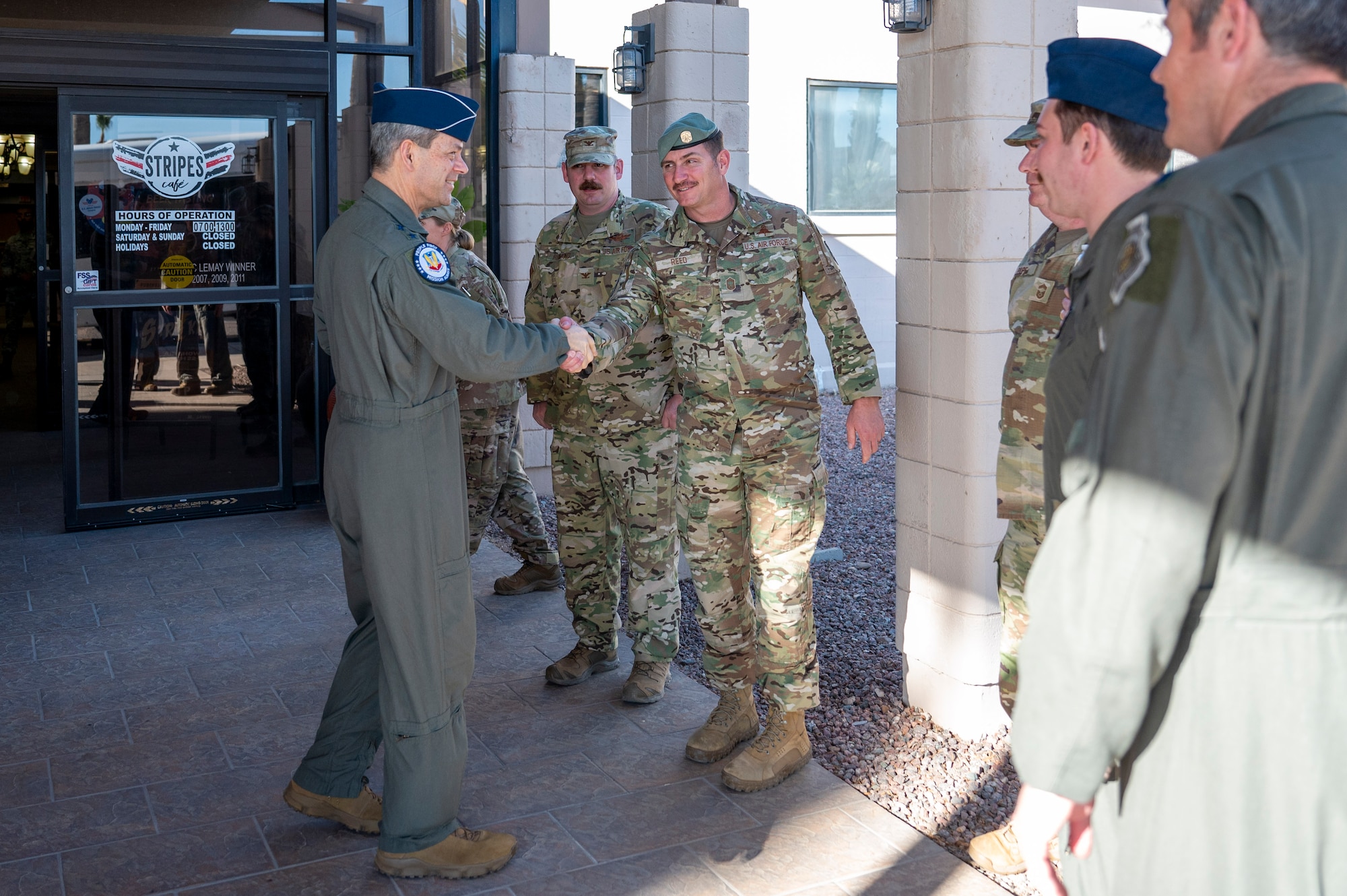 U.S. Air Force Gen. Ken Wilsbach, commander of Air Combat Command, left, shakes hands with Chief Master Sgt. Mike Reed, 563rd Rescue Group senior enlisted leader, after an all call at Davis-Monthan Air Force Base, Arizona, Feb. 27, 2025. During his time at DM, Wilsbach met with leadership from squadrons all around the base. (U.S. Air Force photo by Senior Airman Devlin Bishop)