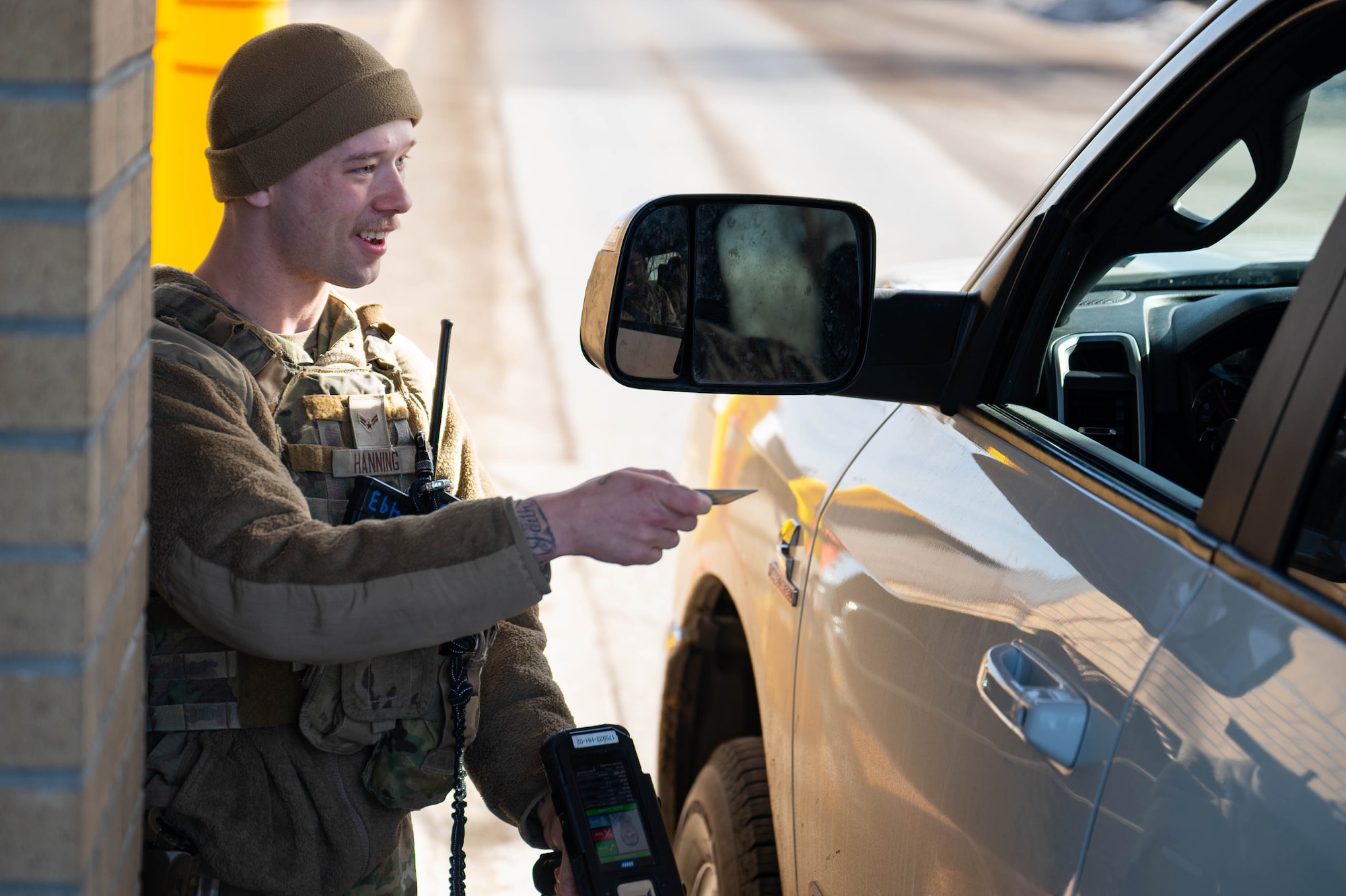 Uniformed personnel perform gate guard duties.