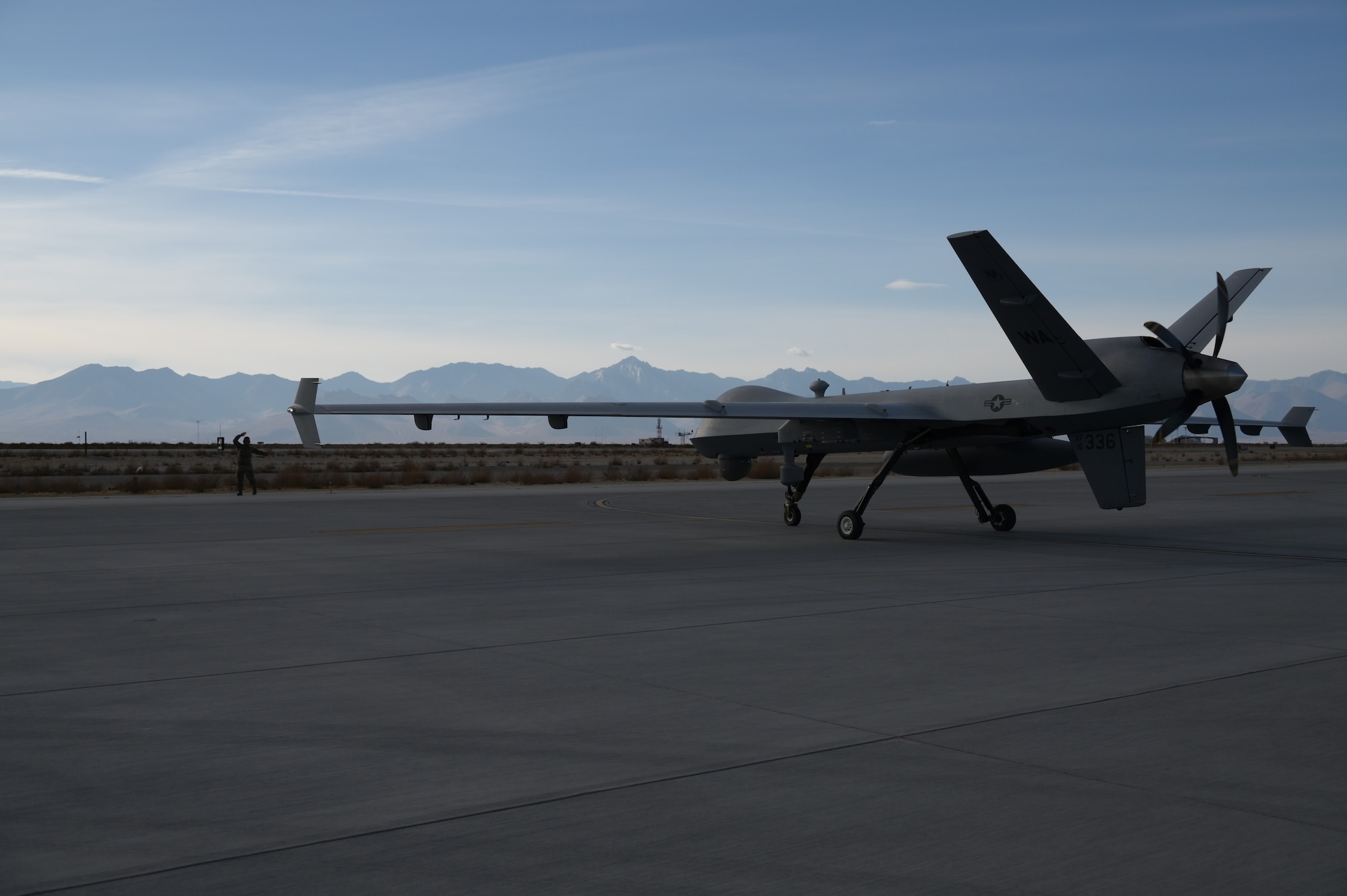 A remotely piloted aircraft taxis on a runway.