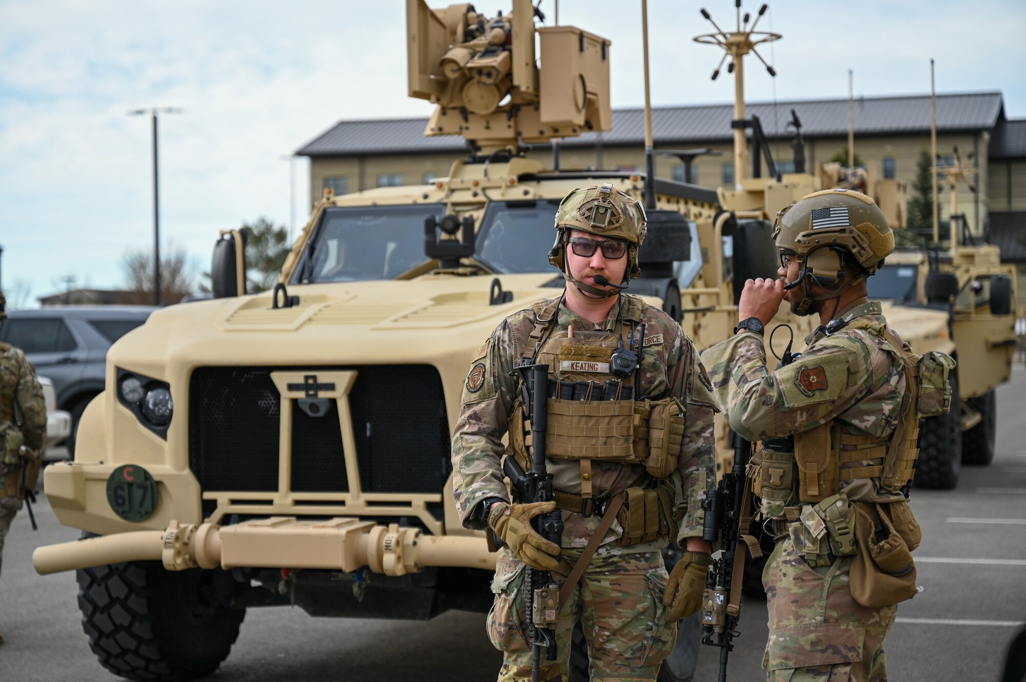 Uniformed personnel provide aid and security to simulated victims of a simulated active shooter.