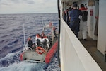 Coast Guard Cutter Vigorous' crew transfers aliens to the Margaret Norvell in the Florida Straits, Feb. 19, 2025. The aliens were transferred to The Bahamas following an illegal maritime venture interdiction off Key Biscayne, Florida. (U.S. Coast Guard photo by Chief Petty Officer Ryan Youngblood)