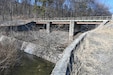The Marquette Lake dam spillway, pictured here on March 3, 2025, will be replaced and the bridge over the spillway will be removed during an upcoming construction project. (Pennsylvania National Guard photo by Brad Rhen)