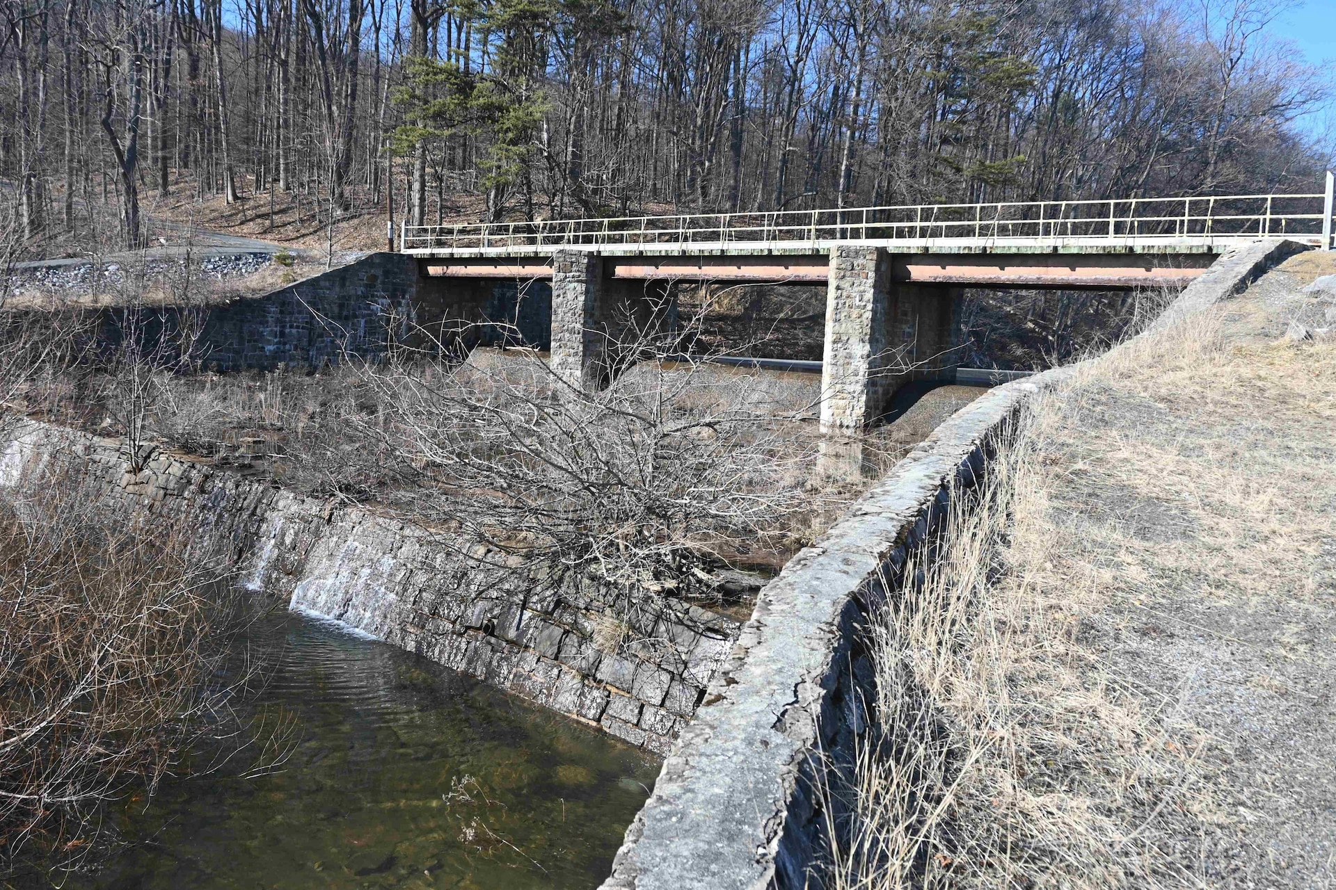 The Marquette Lake dam spillway, pictured here on March 3, 2025, will be replaced and the bridge over the spillway will be removed during an upcoming construction project. (Pennsylvania National Guard photo by Brad Rhen)