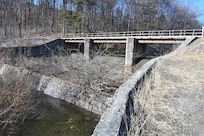 The Marquette Lake dam spillway, pictured here on March 3, 2025, will be replaced and the bridge over the spillway will be removed during an upcoming construction project. (Pennsylvania National Guard photo by Brad Rhen)