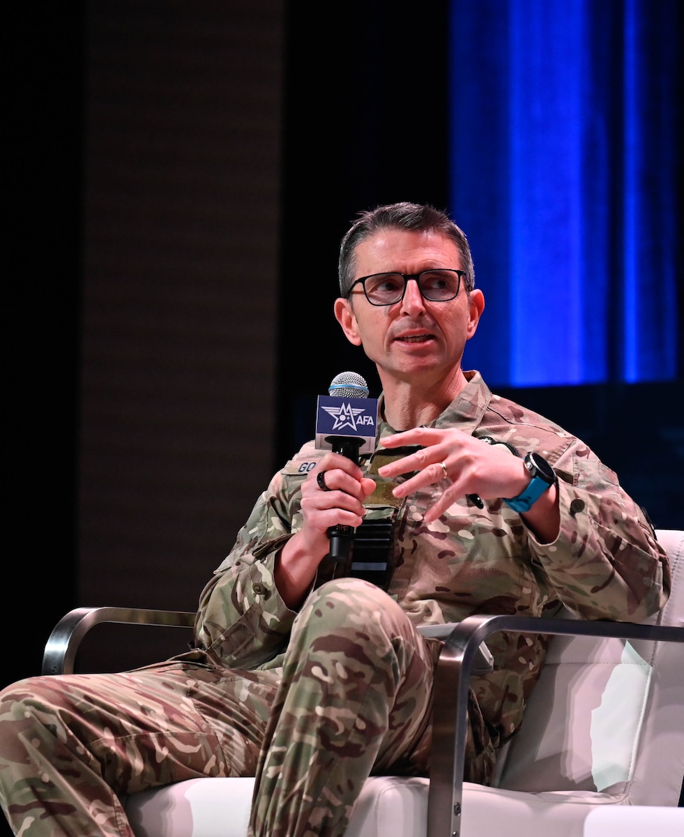 Royal Air Force Air Marshal Paul Godfrey speaks during a discussion panel