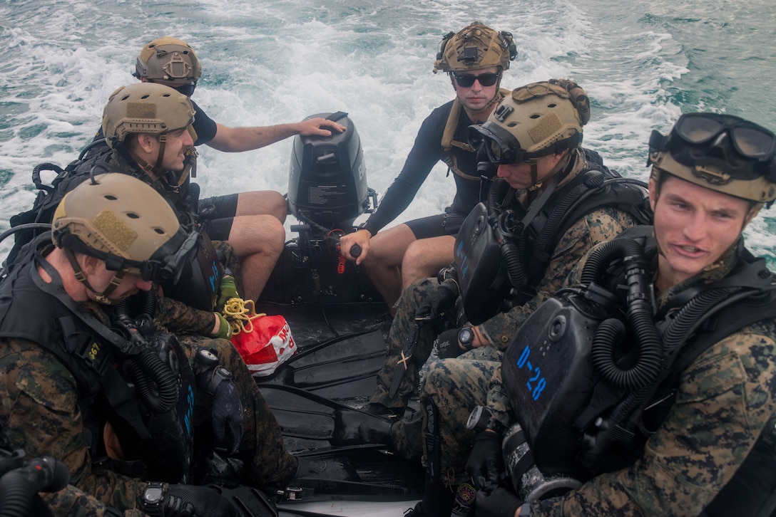 U.S. Marines with 1st Reconnaissance Battalion, 1st Marine Division, conduct dive training in Kaneohe Bay, Hawaii, Feb. 24, 2025. 1st Reconnaissance Battalion conducted the training to enhance rapid insertion capabilities in littoral zones as preparation for integrating with 3d Marine Littoral Regiment and its subordinate battalions while forward in the Philippines for Exercise Balikatan 25 and Kamandag 9 this summer. (U.S. Marine Corps photo by Cpl. Jonathan Beauchamp)