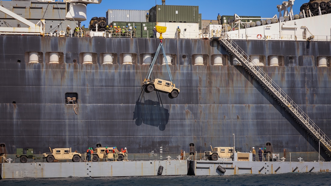 Navy Cargo Handling Battalion 13 operates a crane to transfer vehicles and equipment Feb. 28 from the USNS Dahl to an Improved Navy Lighterage System during Freedom Banner 25 at the Republic of Korea Marine Corps Base Pohang, South Korea. (Official U.S. Marine Corps Photo/Cpl. Nicholas Martinez)