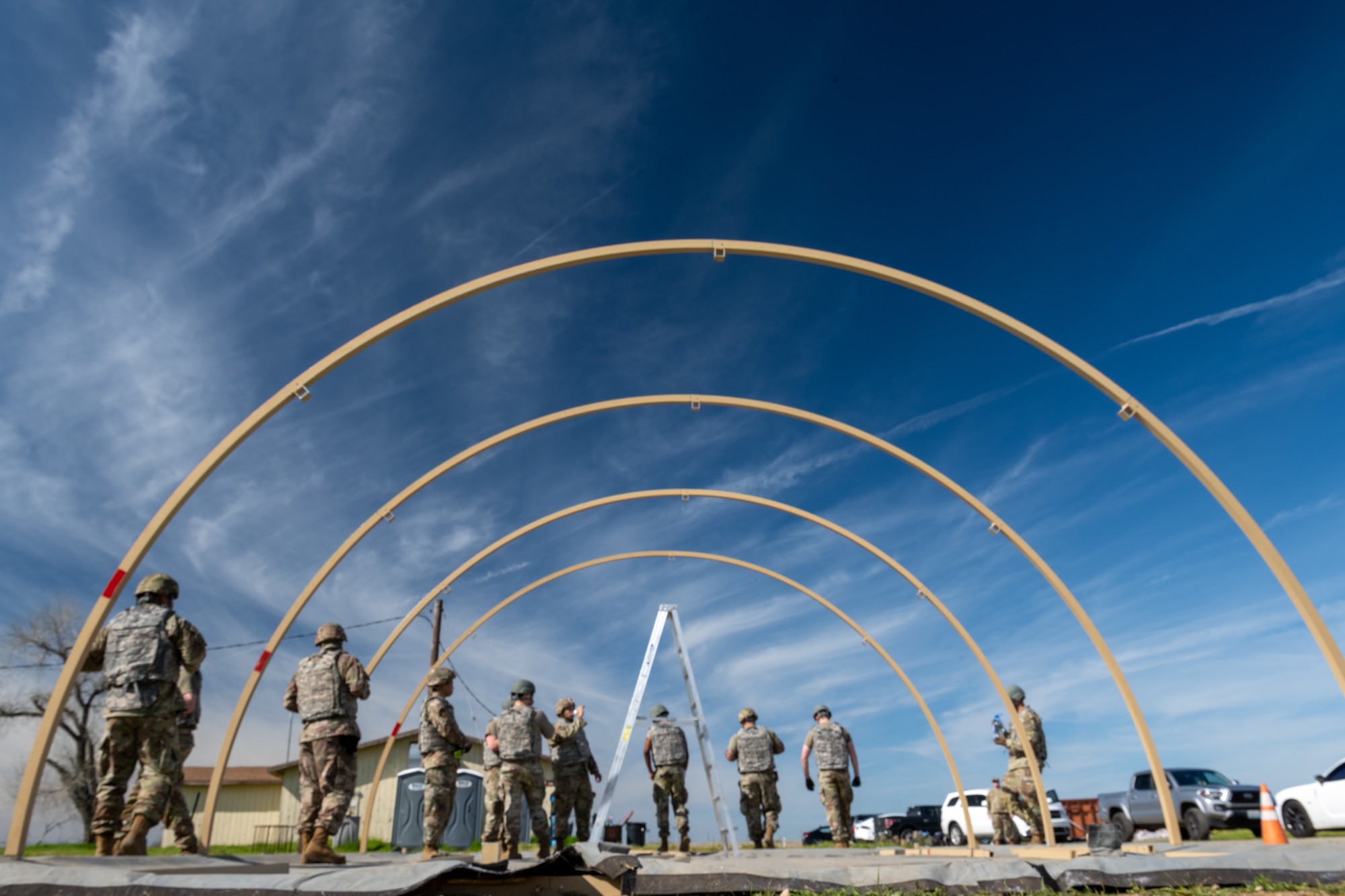 Airmen set up tents for a field exercise