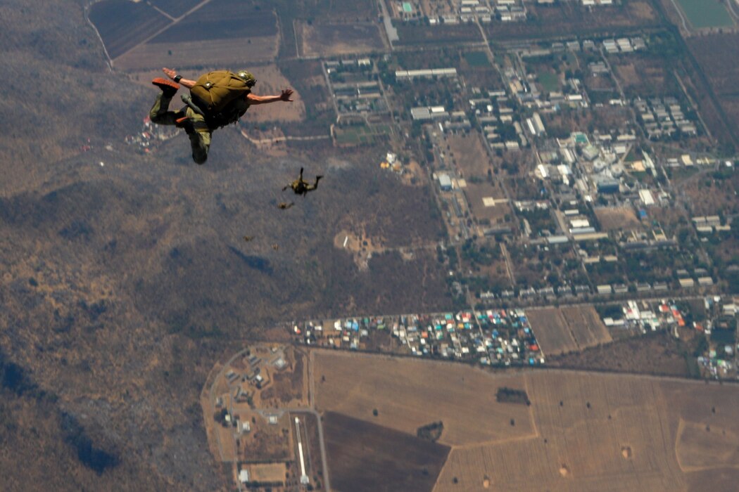 Air Commandos from the 353rd Special Operations Wing perform a military free-fall near Lop Buri, Thailand, Feb. 27, 2025, during Exercise Cobra Gold.