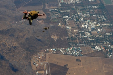 LOP BURI, Thailand (Feb. 27, 2025) — Air Commandos from the 353rd Special Operations Wing perform a military free-fall near Lop Buri, Thailand, Feb. 27, 2025, during Exercise Cobra Gold. The 353rd SOW is the focal point for special operations aviation activities throughout the Pacific. U.S. Special Operations Command Pacific serves as the operational component command for all SOF missions throughout the Indo-Pacific region. Cobra Gold 25 – the 44th iteration of this exercise – exemplifies a longstanding alliance with Thailand and reflects a shared commitment to preserving a peaceful, prosperous, and secure Indo-Pacific region. (U.S. Air Force photo by Staff Sgt. Matthew J. Wisher)