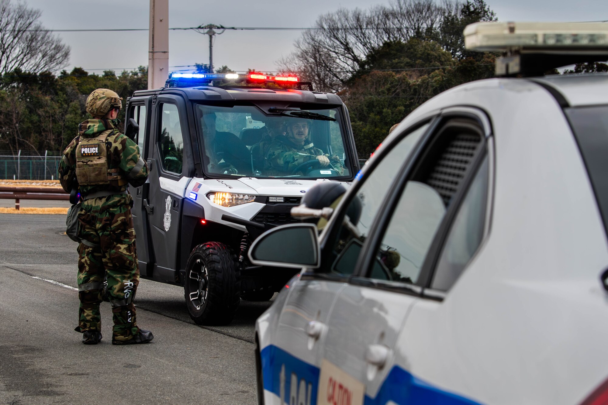 Defenders assigned to the 374th Security Forces Squadron transport a simulated active shooter suspect.