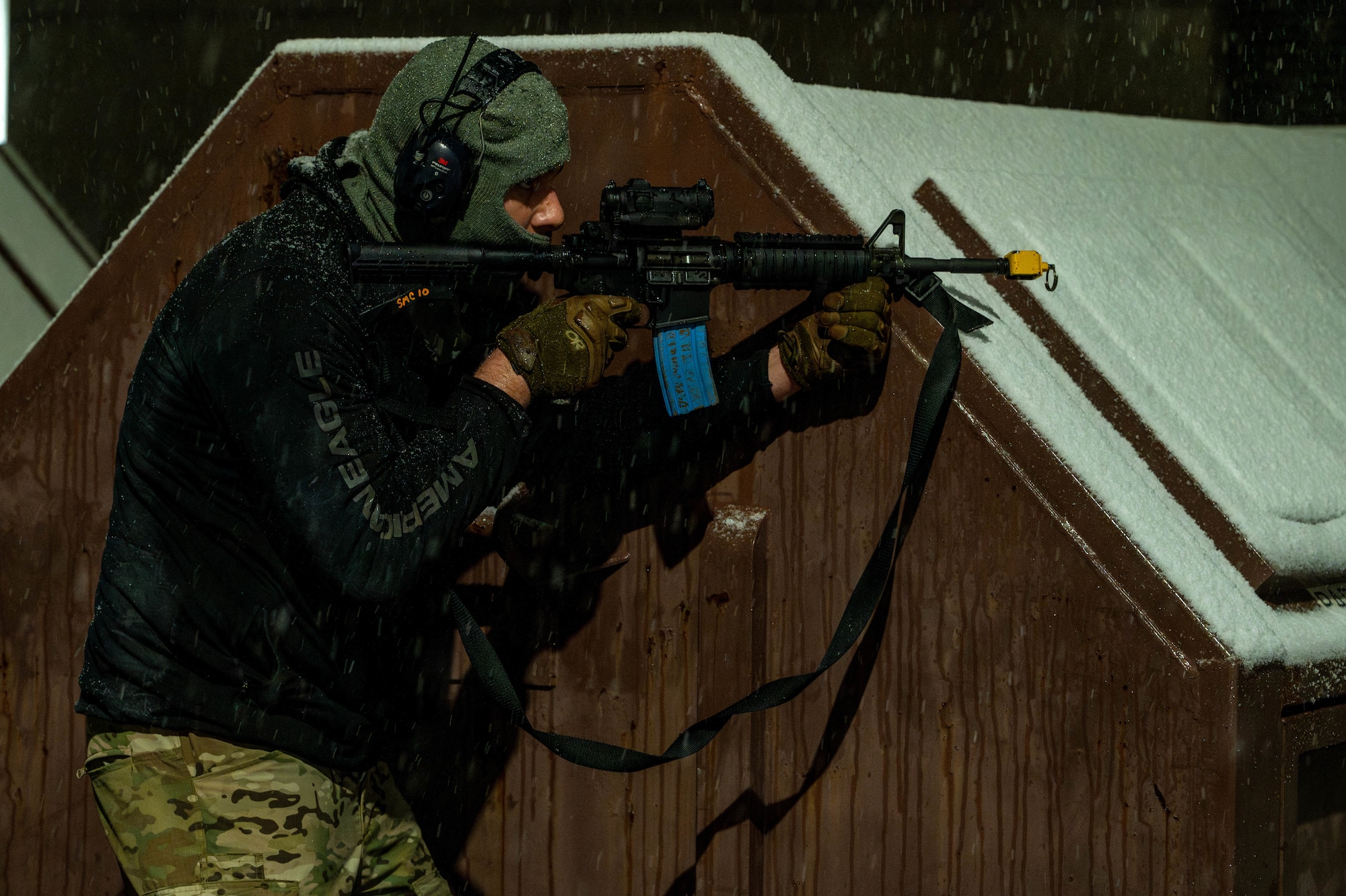 A simulated enemy combatant aims a weapon