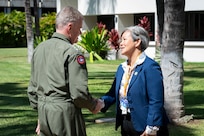 Adm. Samuel J. Paparo, commander of U.S. Indo-Pacific Command, is greeted by Suzanne Vares-Lum, director of the Daniel K. Inouye Asia-Pacific Center for Security Studies in Honolulu, March 5, 2025.