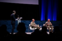 Military members speak at a panel.