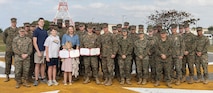 Okinawa, Japan — The wind was crisp as Marines stood in formation, with family and friends coming together in the winter morning. As the medal, the countenance of George Washington set in violet, was pinned over Faffler’s heart, his wife and children by his side, it was hard to not shed a tear as emotions were heightened during this special moment.