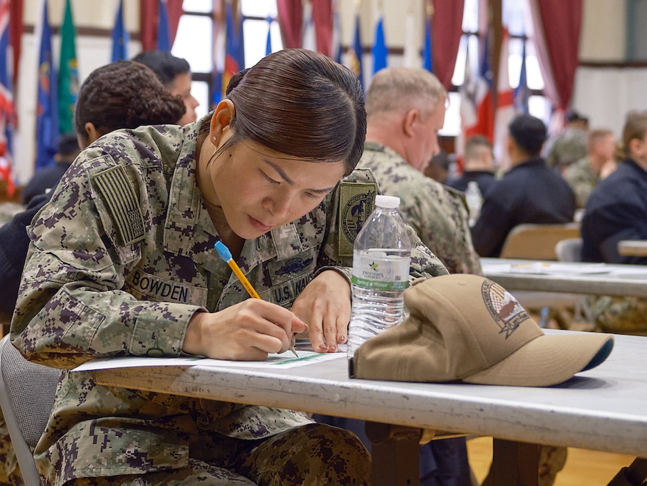 Petty Officers verify their information and prepare their answer sheets before the start of the Navy E6 Advancement Examination March 6 in the C2 Auditorium at Commander, Fleet Activities Yokosuka Headquarters.