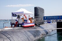240809-N-SS900-1202 SAN DIEGO (Aug. 9, 2024) Capt. William Wiley speaks during a change of command ceremony for Commander Submarine Squadron (COMSUBRON) 11 held aboard Los Angeles-class fast-attack submarine USS Hampton (SSN 767) at Naval Base Point Loma, Aug. 9, 2024. During the ceremony, Wiley relieved Capt. Kenneth Douglas as commander of COMSUBRON 11. (U.S. Navy photo by Mass Communication Specialist 1st Class Aaron T. Smith)