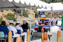 240809-N-SS900-1216 SAN DIEGO (Aug. 9, 2024) Capt. William Wiley speaks during a change of command ceremony for Commander Submarine Squadron (COMSUBRON) 11 held aboard Los Angeles-class fast-attack submarine USS Hampton (SSN 767) at Naval Base Point Loma, Aug. 9, 2024. During the ceremony, Wiley relieved Capt. Kenneth Douglas as commander of COMSUBRON 11. (U.S. Navy photo by Mass Communication Specialist 1st Class Aaron T. Smith)