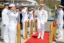 240809-N-SS900-1224 SAN DIEGO (Aug. 9, 2024) Capt. Kenneth Douglas passes through sideboys during a change of command ceremony for Commander Submarine Squadron (COMSUBRON) 11 held aboard Los Angeles-class fast-attack submarine USS Hampton (SSN 767) at Naval Base Point Loma, Aug. 9, 2024. During the ceremony, Capt. William Wiley relieved Douglas as commander of COMSUBRON 11. (U.S. Navy photo by Mass Communication Specialist 1st Class Aaron T. Smith)