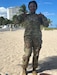 Female U.S. Army Soldier in uniform poses on a beach