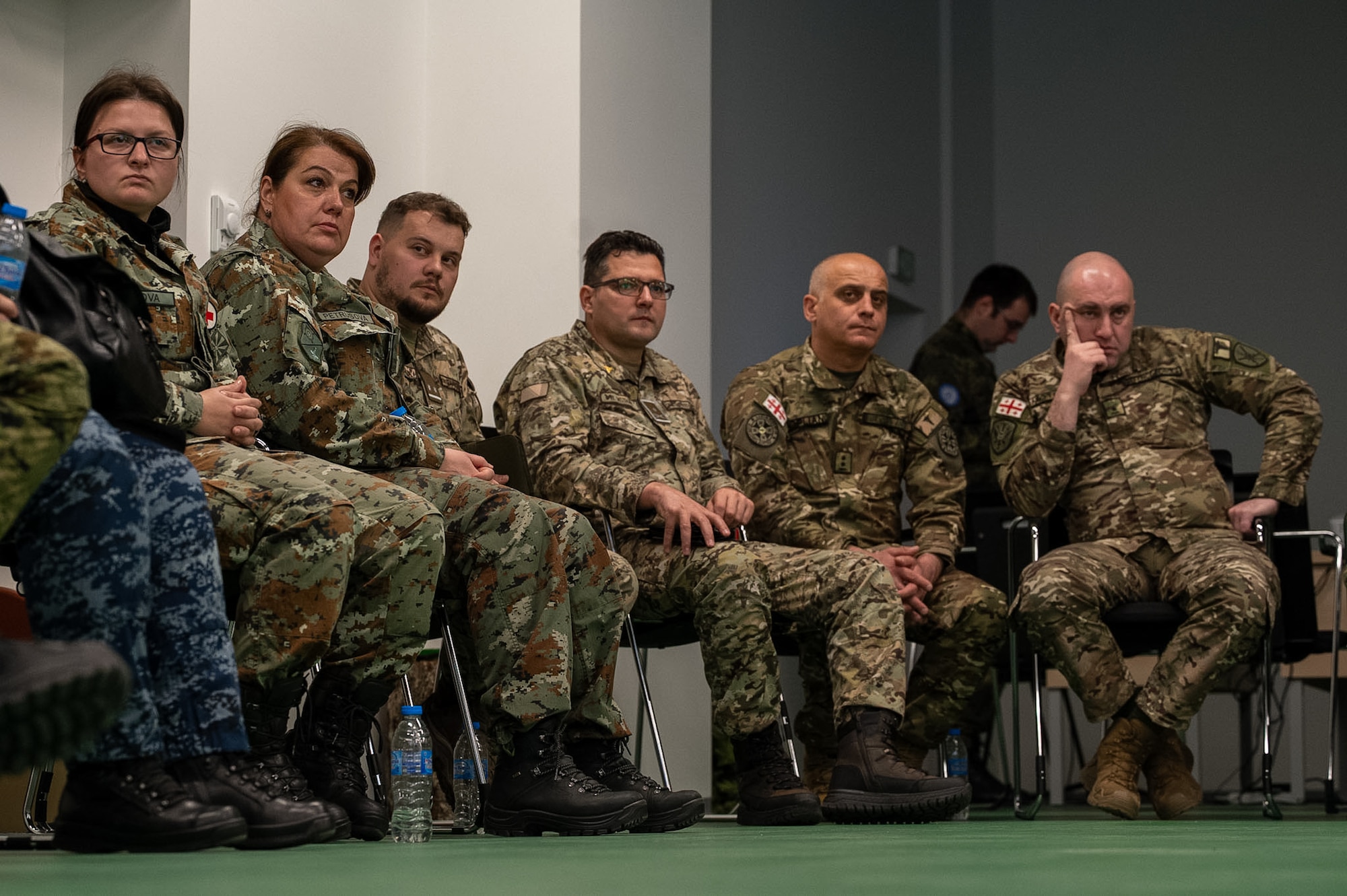 participants gather in a discussion circle during Bulgarian Multilateral Medical Simulation Training Engagement at the Military Medical Simulation Center in Sofia, Bulgaria, Feb. 24, 2025.