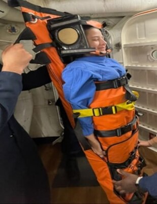 [240828]- N- [FT324] – [1739]. ROTA, Spain. Aug. 28, 2024. Hospitalman Raphaele Aguiar assigned to the USS Bulkeley (DDG 84) simulates a casualty requiring immediate medical assistance during an exercise to practice safe transfer techniques in a confined space. Stretcher bearer instruction is a critical skill that enables personnel to handle medical emergencies quickly and efficiently. (U.S. Navy Photo by Hospitalman Amy Pierre Pion / Released by Lt. Cmdr. Alicia Sacks)