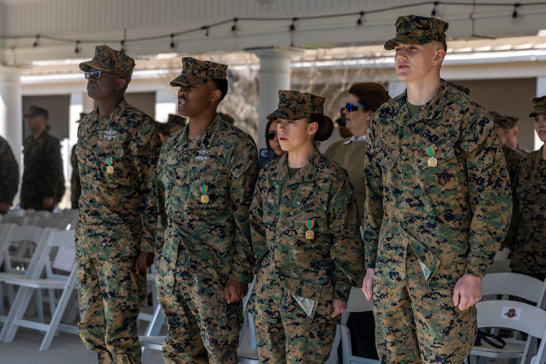 U.S. Marines and Sailors with II Marine Expeditionary Force sing the Marines’ Hymn during a ceremony for the Marines and Sailors of the Year for II MEF at Marine Corps Base Camp Lejeune, North Carolina, Feb. 27, 2025. The Marine of the Year and Sailor of the Year distinctions recognize Marines and Sailors who exceed expectations and have contributed significantly to the mission effectiveness of their unit. (U.S. Marine Corps photo by Lance Cpl. John Allen)