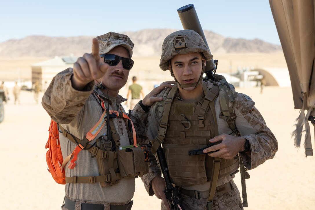 U.S. Marine Corps Staff Sgt. Benjamin Allred, a Tombstone, Arizona native, signals intelligence analyst with Tactical Training and Exercise Control Group, Marine Air-Ground Task Force Training Command, Marine Corps Air-Ground Combat Center, left, provides instruction to Pfc. Calvin Antholz, a Tecumseh, Nebraska native, signals intelligence analyst with 2nd Radio Battalion, II MEF Information Group, II Marine Expeditionary Force, during a Tactical Signal Intelligence Course as part of Integrated Training Exercise 1-25 at Camp Wilson, MCAGCC, Twentynine Palms, California, Jan. 18, 2025. Signals Intelligence courses empower Marines to intercept, analyze, and exploit enemy communications, providing a decisive edge in complex operational environments. ITX is part of the Service-Level Training Exercise Program provided by Marine Air-Ground Task Force Training Command through a cadre of instructors committed to developing high-caliber Marines. (U.S. Marine Corps photo by Cpl. Connor Webb)