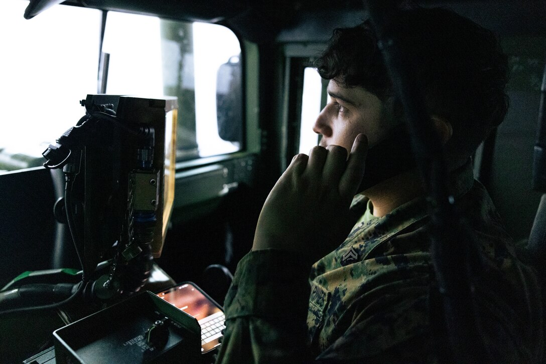 U.S. Marine Corps Cpl. Argelio Zamora, a motor vehicle operator with 8th Engineer Support Battalion, Combat Logistics Regiment 27, 2nd Marine Logistics Group, conducts radio checks during a combat convoy simulator as part of an Explosive Hazards Improvised Threat (EHIT) Basic Leaders Course at Marine Corps Base Camp Lejeune, North Carolina, Feb. 6, 2025. The EHIT Basic Leaders Course is a unique training that teaches Marines how to handle explosive hazards and improvised threats, build skills, teach others, and stay ready for dangerous environments. (U.S. Marine Corps photo by Cpl. Maurion Moore)