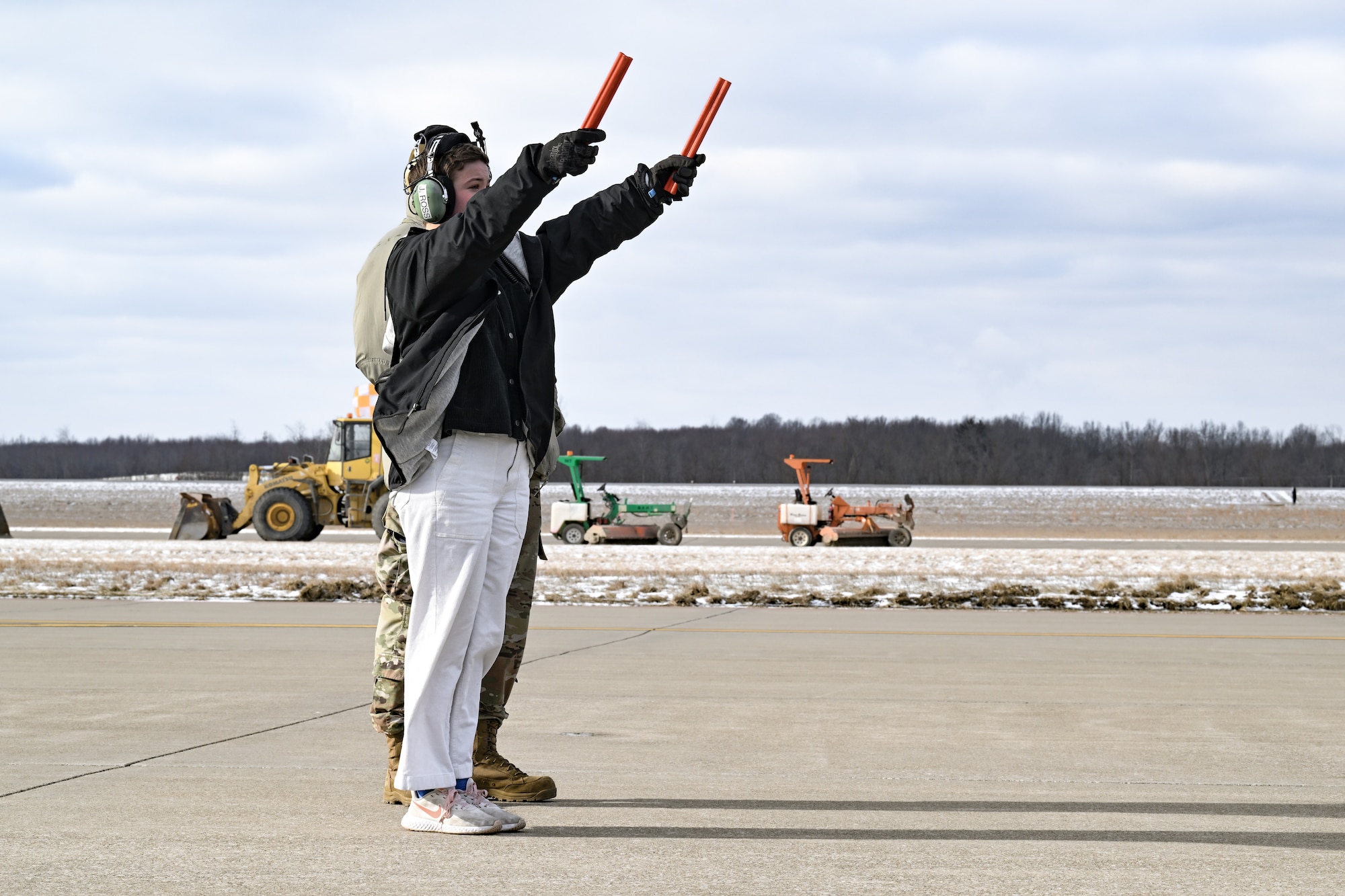 The daughter of Col. Michael Maloney, 910th Airlift Wing commander, marshals her father as he departs for his “fini-flight” at Youngstown Air Reserve Station, Ohio, March 2, 2025.