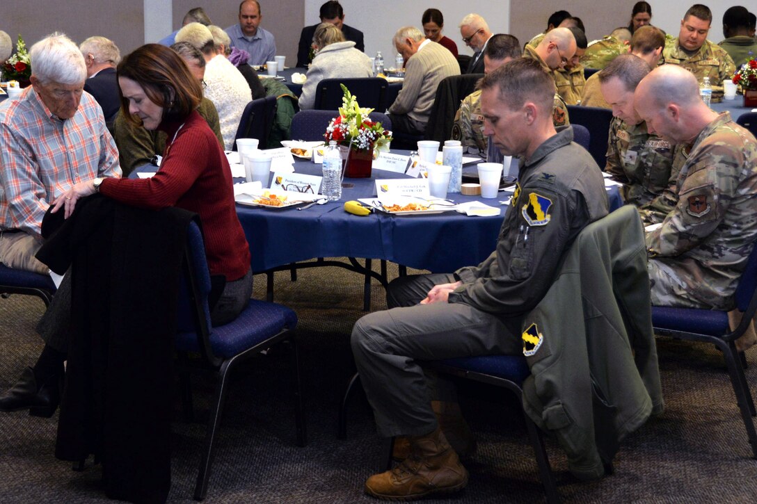 Members of Sheppard Air Force Base and Wichita Falls local community leaders listen to an invocation during the National Prayer Breakfast, February 19, 2025
