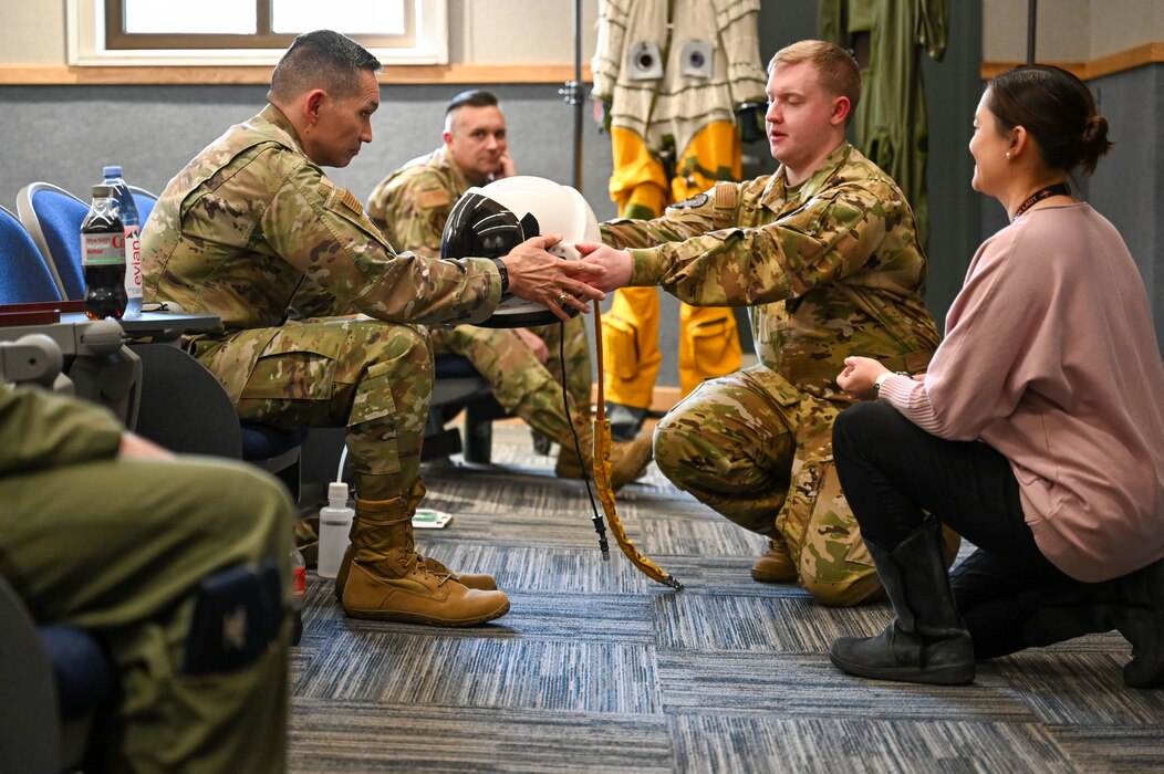 U.S. Air Force Lt. Gen. Thomas Hensley,

Commander, 16th Air Force (Air Forces

Cyber), learns about the S-1010 pressure

suit at Beale Air Force Base, California,

Feb. 20, 2025.