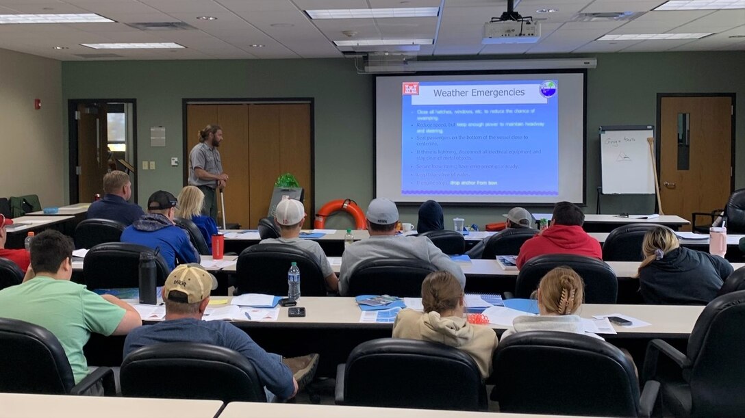 A park ranger explains weather emergency procedures to participants during a boater safety course at the Mississippi River Project Office.