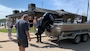 A park ranger demonstrates safe boat trailering practices during a boater safety course at the Mississippi River Project Office.