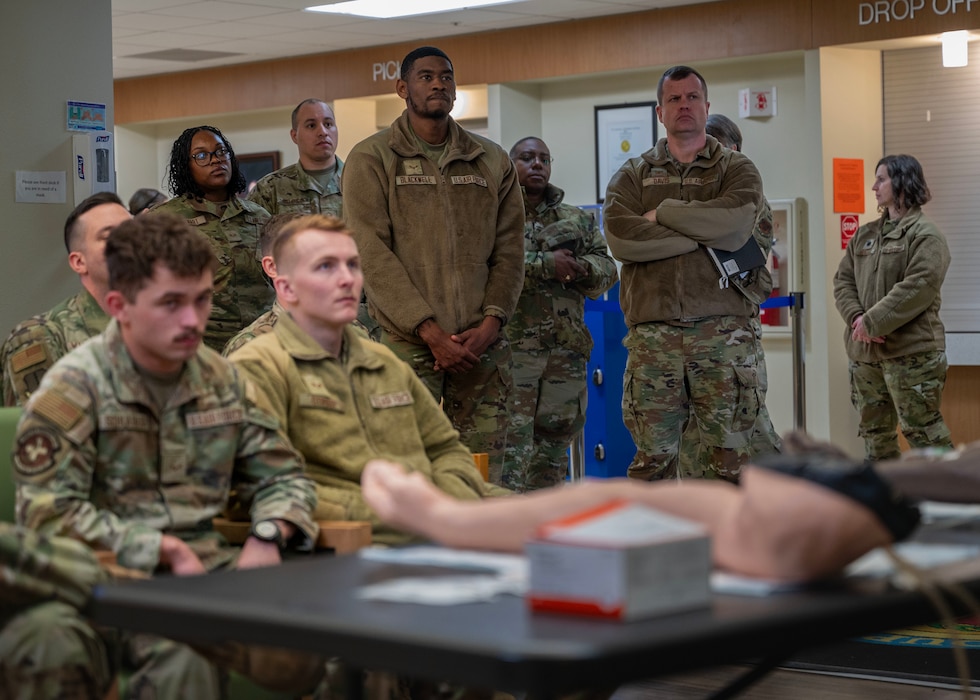 U.S. Air Force Col. John Davis, Air Education and Training Command command surgeon, observes MEDIC-X training during a visit at Goodfellow Air Force Base, Texas, Feb. 20, 2025. MEDIC-X provides comprehensive, base-level patient care that can be easily taught through hands-on, in-person training to any medical personnel, regardless of their regular patient care duties, covering essential tasks such as assessing pain levels, infection control, taking vital signs, assisting with spinal immobilization, patient movement and respiratory care. (U.S. Air Force photo by Senior Airman Sarah Williams)