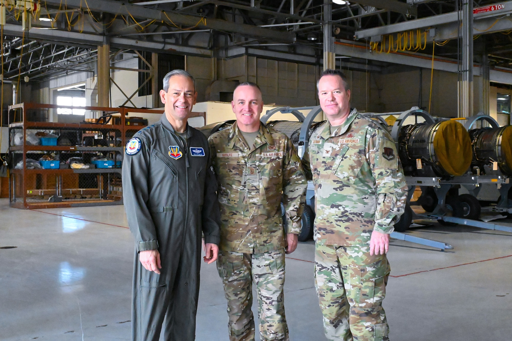Three Airmen posing for a group photo.