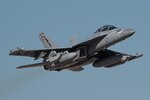 A U.S. Navy E/A-18G Growler assigned to Naval Air Station Fallon, Nevada takes off for a Weapons School Integration mission at Nellis Air Force Base, Nevada, May 29, 2024. The U.S. Air Force Weapons School provides academic and advisory support to numerous units, enhancing air combat training for thousands of Airmen from the Air Force, Department of Defense and U.S. allied services each year. (U.S. Air Force photo by Senior Airman Jose Miguel T. Tamondong)