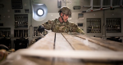 Airman secures dunnage