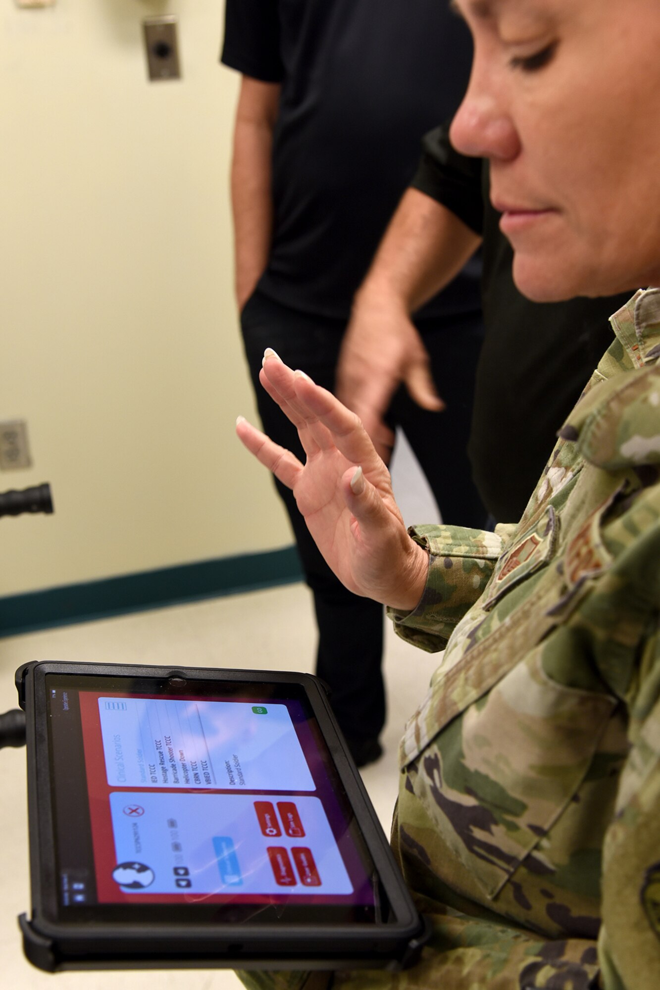 Photograph of Air National Guard master sergeant holding an iPad.