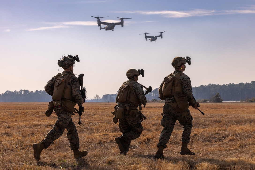 U.S. Marines with the 26th Marine Expeditionary Unit (MEU) prepare for extraction after conducting a raid during an Expeditionary Operations Training Group (EOTG) exercise at Camp Lejeune, North Carolina, Feb. 25, 2025. The 26th MEU completed their full mission profile to assess their ability to operate as a Marine Air Ground Task Force across various crisis response scenarios. EOTG trains II Marine Expeditionary Force units in preparation for upcoming deployments in support of geographic combatant commands. (U.S. Marine Corps photo by Lance Cpl. Kyle Baskin)