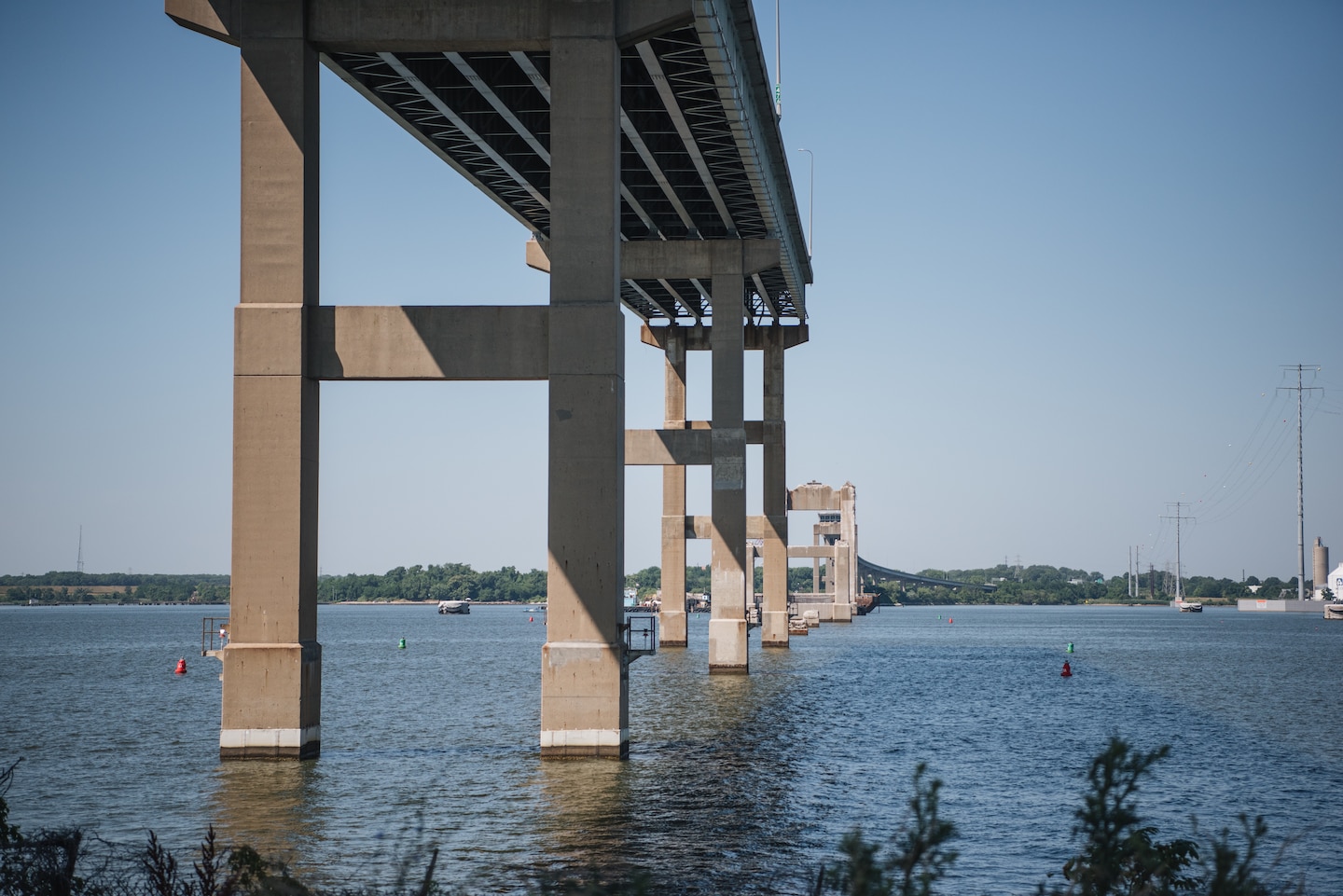 The approach from the northern/Dundalk side of the original Key Bridge structure is seen still standing from the shoreline, June 21, 2024. (U.S. Army Corps of Engineers photo by Thomas I. Deaton)
