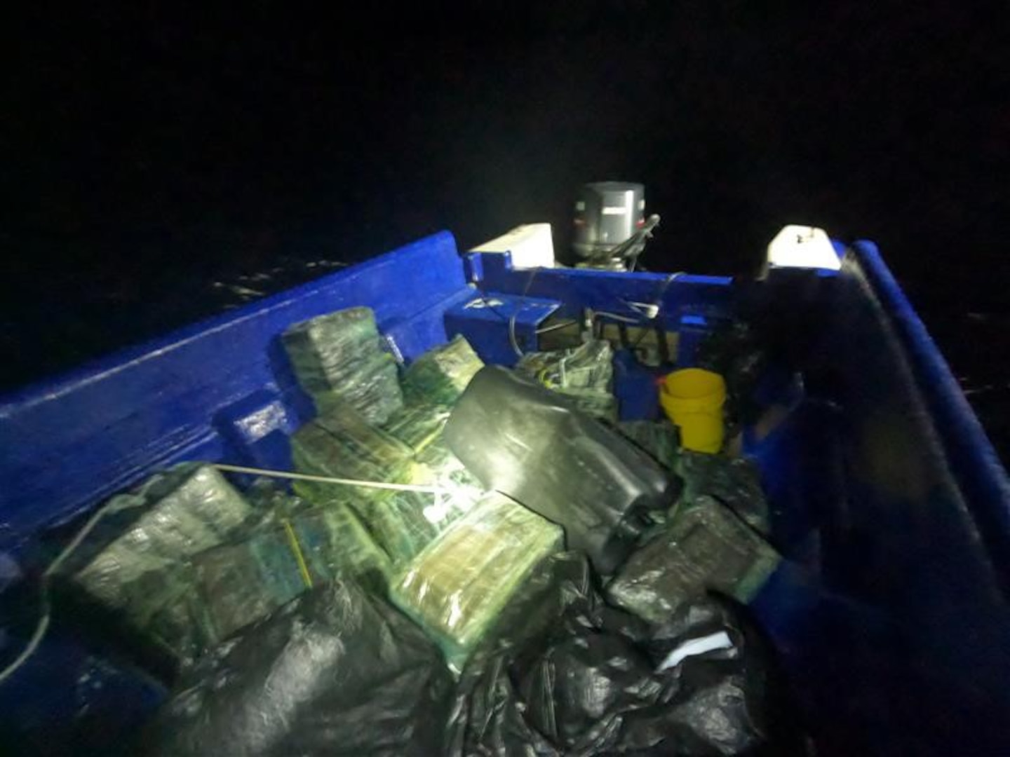 Bales of illicit drugs is photographed in a go-fast vessel after an interdiction approximately 35 miles southwest of the U.S. Virgin Islands, Feb. 2, 2025. A forward-deployed HC-144 Ocean Sentry aircrew from Coast Guard Air Station Miami detected a suspicious vessel and vectored in the USCGC Joseph Doyle (WPC 1133) crew who apprehended three suspected smugglers and seized approximately 2,200 pounds of cocaine. (U.S. Coast Guard photo)