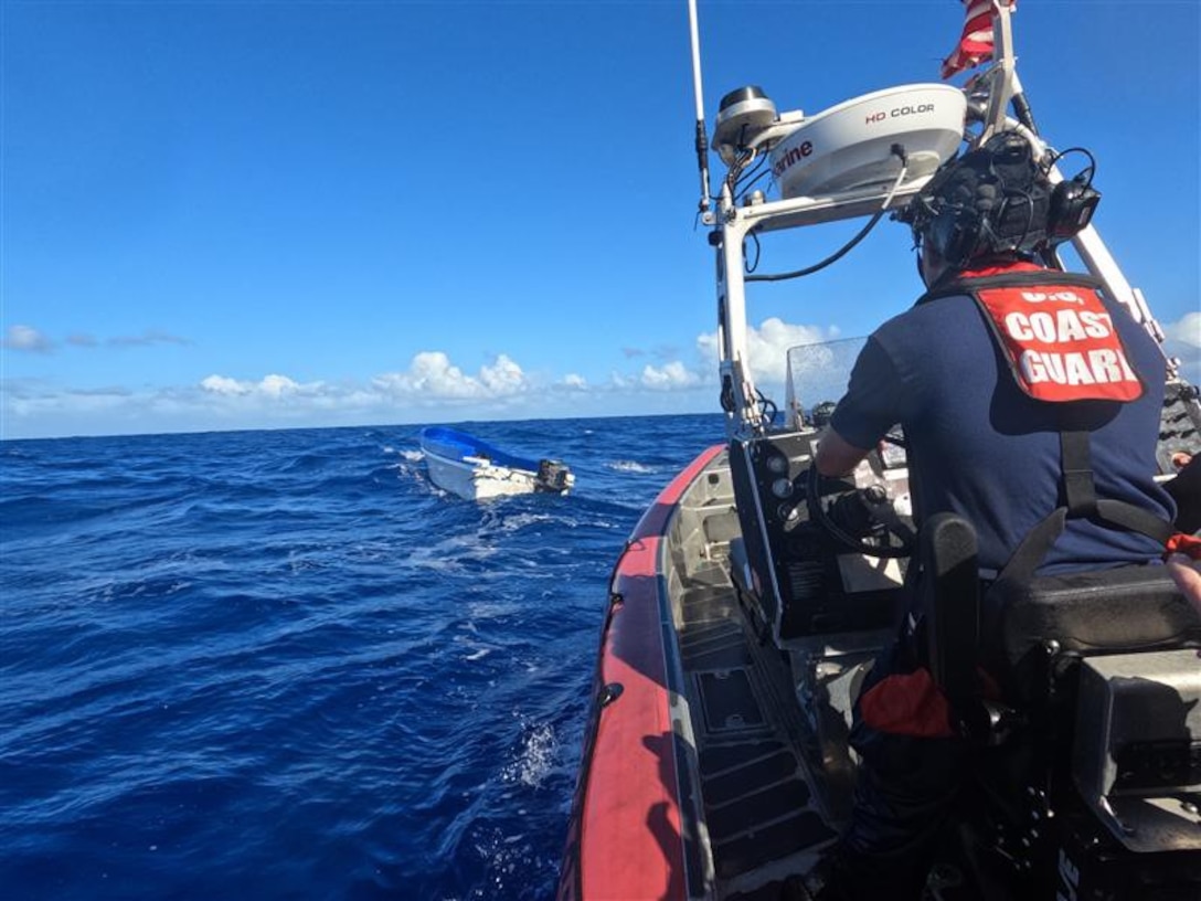 A USCGC Joseph Doyle (WPC 1133) small boat crew approaches a go-fast vessel involved in a drug interdiction approximately 35 miles southwest of the U.S. Virgin Islands, Feb. 2, 2025. A forward-deployed HC-144 Ocean Sentry aircrew from Coast Guard Air Station Miami detected a suspicious vessel and vectored in the Joseph Doyle crew who apprehended three suspected smugglers and seized approximately 2,200 pounds of cocaine. (U.S. Coast Guard photo)