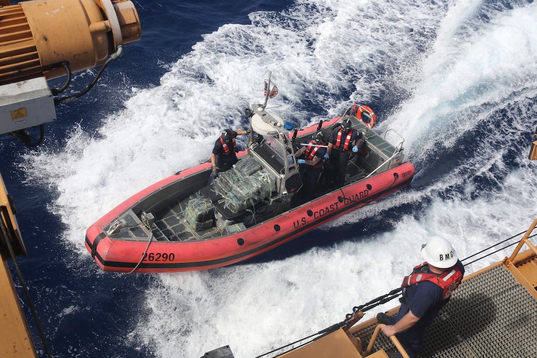 A USCGC Valiant (WMEC 621) law enforcement team prepares to get a small boat lifted aboard the cutter after a drug interdiction approximately 50 miles northeast of the Dominican Republic, Feb. 17, 2025. U.S. Customs and Border Protection Air and Marine Operations aircrew detected the suspicious vessel and vectored in the Valiant crew who apprehended five suspected smugglers and seized approximately 1,280 pounds of cocaine. (U.S. Coast Guard photo by Seaman Reese Fishbaugh)