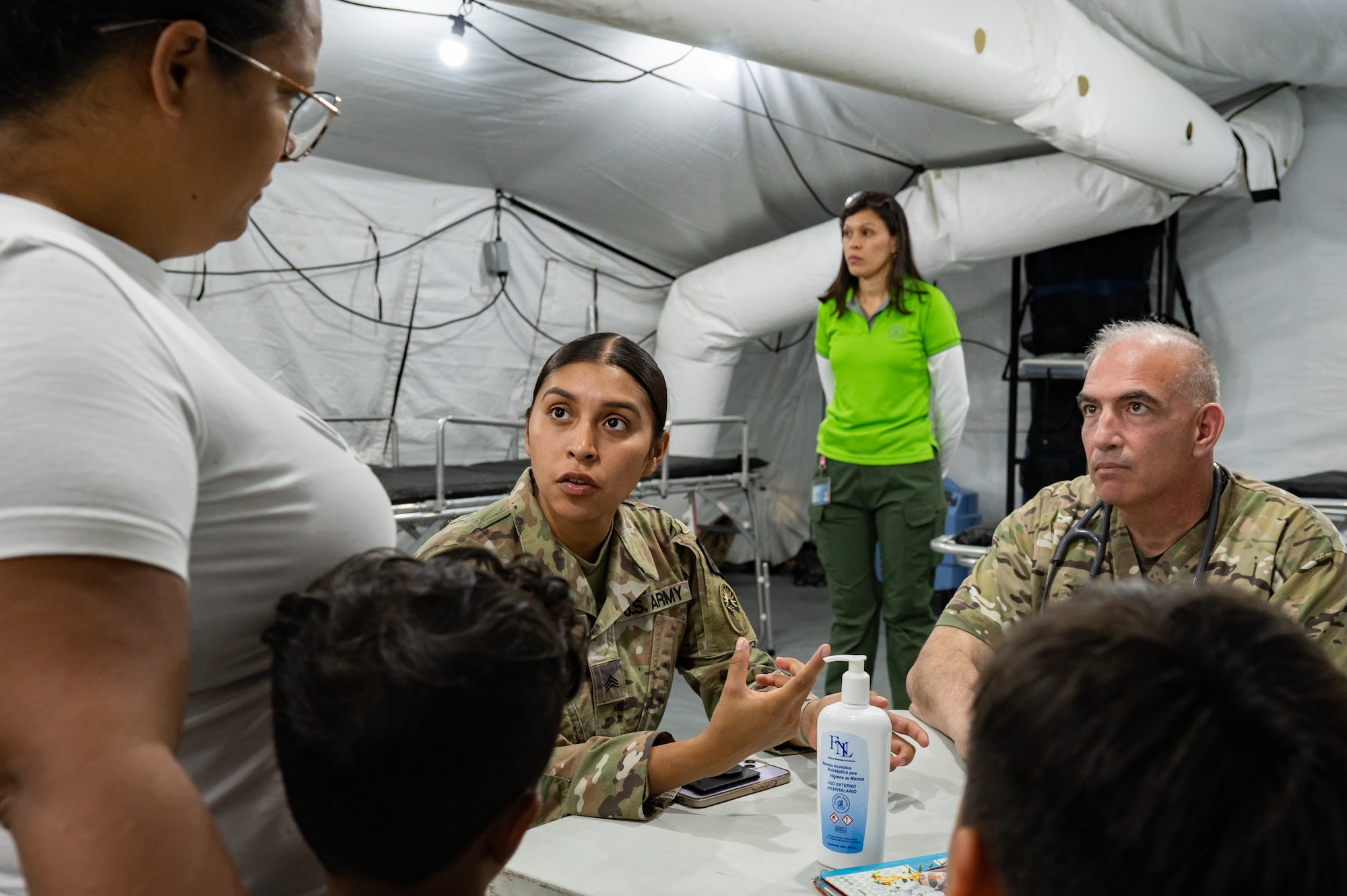 U.S. Army Sgt. Giselle Aguilar, Joint Task Force-Bravo 349th Medical Detachment medic, and Col. Lance Weagant, JTF-Bravo 349th Medical Detachment medical provider, speak with a patient during a Medical Readiness Training Exercise in Pejibaye, Costa Rica, February 25, 2025.