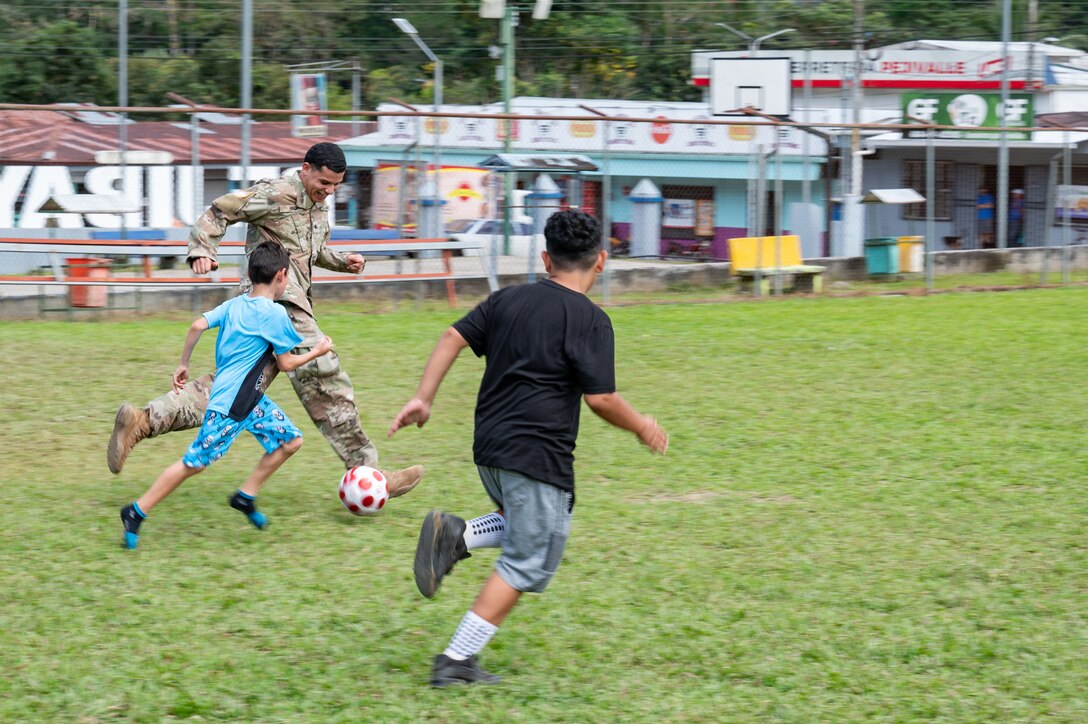 U.S. Army Spc. Jaden King, Joint Task Force-Bravo 349th Medical Detachment medic, plays soccer with local children during a Medical Readiness Training Exercise in Pejibaye, Costa Rica, February 25, 2025.