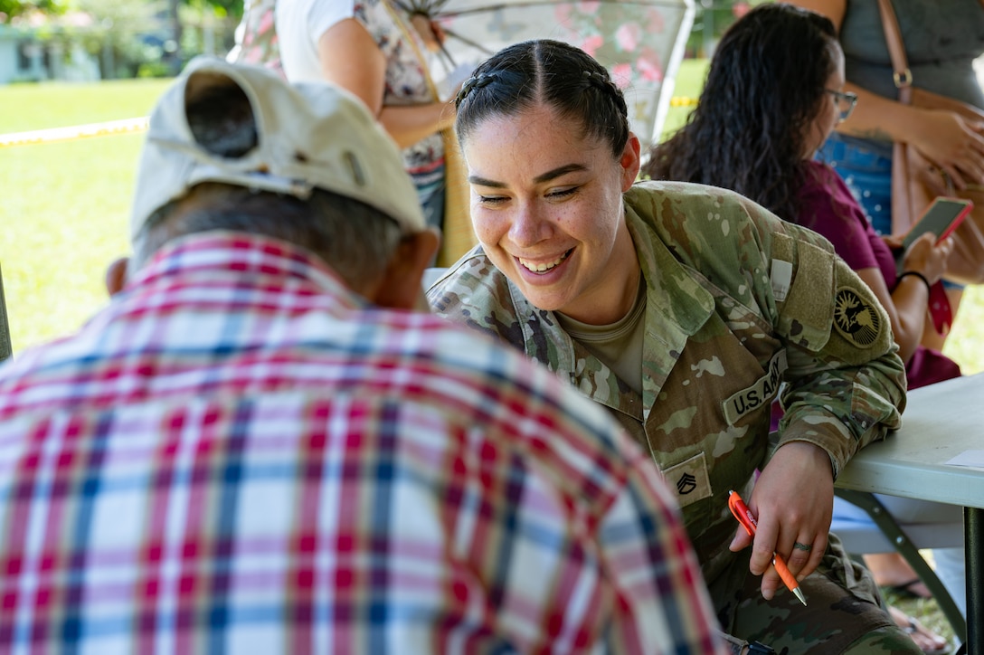 U.S. Army Staff Sgt. Guiomar Davila, Joint Task Force-Bravo 349th Medical Detachment medic, speaks with a patient during a Medical Readiness Training Exercise in Pejibaye, Costa Rica, February 26, 2025.