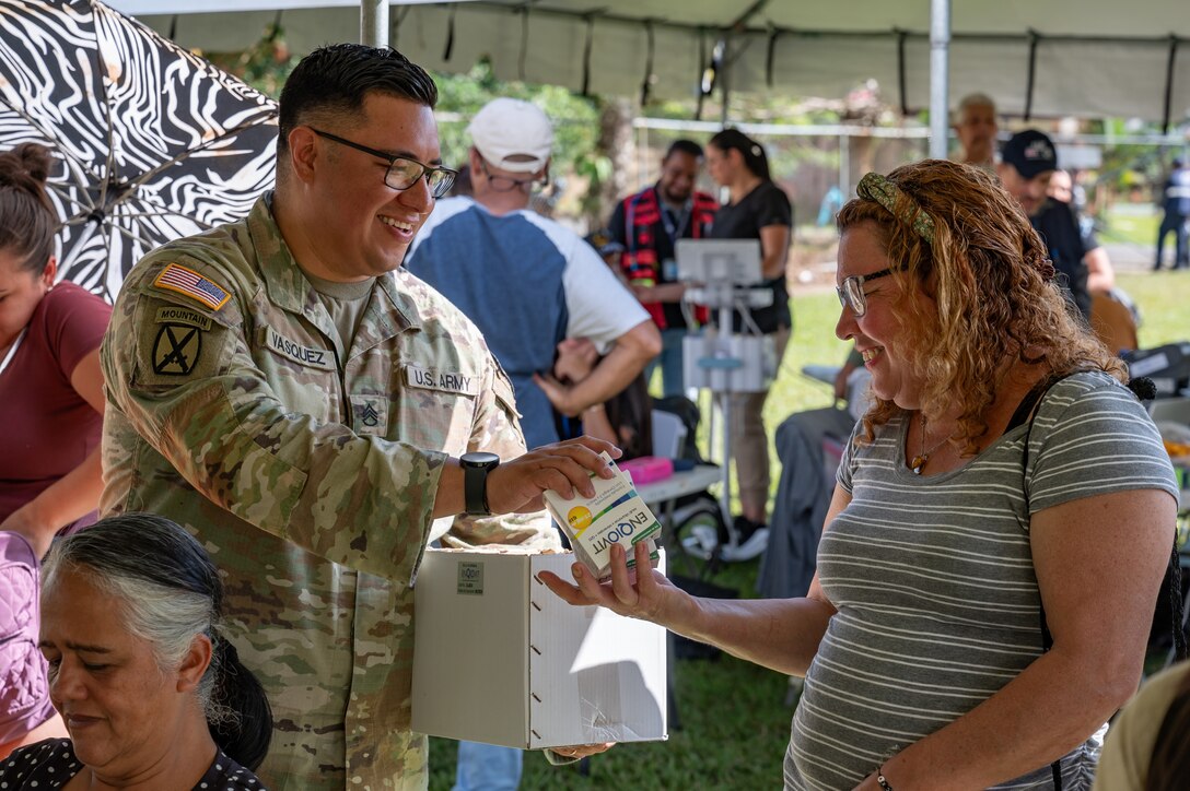 U.S. Army Staff Sgt. Jorge Vasquez, Joint Task Force-Bravo 349th Medical Detachment preventive medicine specialist, hands out preventive medication during a Medical Readiness Training Exercise in Pejibaye, Costa Rica, February 27, 2025.