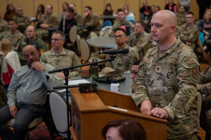 U.S. Air Force Maj. Jedidiah Rodgers, 35th Maintenance Group staff commander, asks a question during a town hall at Misawa Air Base, Japan, March 5, 2025.