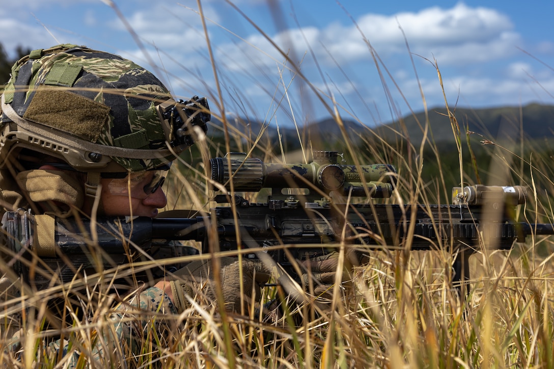U.S. Marine Corps Lance Cpl. Jackson Bracken fires an M27 Infantry Automatic Rifle during a live-fire range on Camp Hansen, Okinawa, Japan, Feb. 14, 2025. The four-day field exercise focused on marksmanship skills and fire team fire and movement, strengthening the unit’s combat capabilities. Live-fire ranges give Marines the opportunity to engage and destroy targets in a dynamic environment, enhancing battlefield effectiveness. Bracken, a native of Texas, is an infantry rifleman with 12th Marine Littoral Regiment, 3d Marine Division. (U.S. Marine Corps photo by Lance Cpl. Rodney Frye)